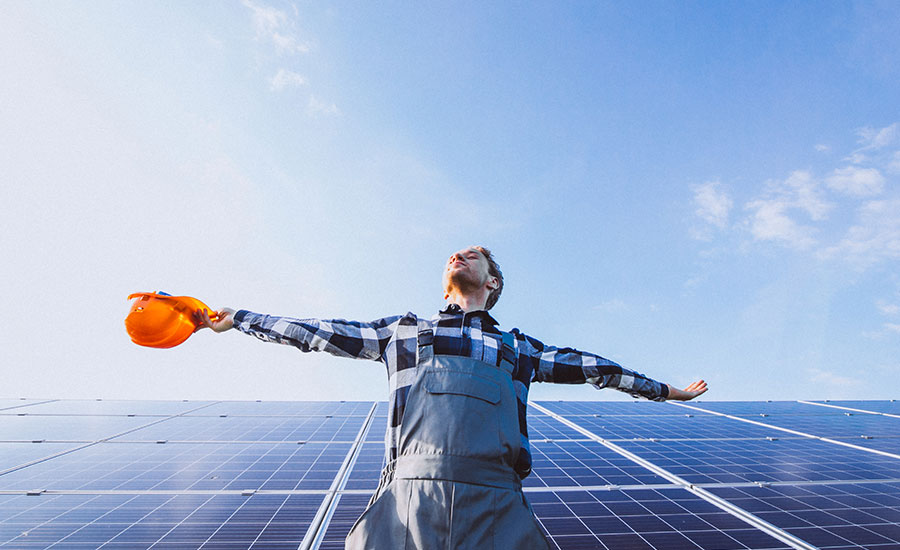 person sand on solar panels